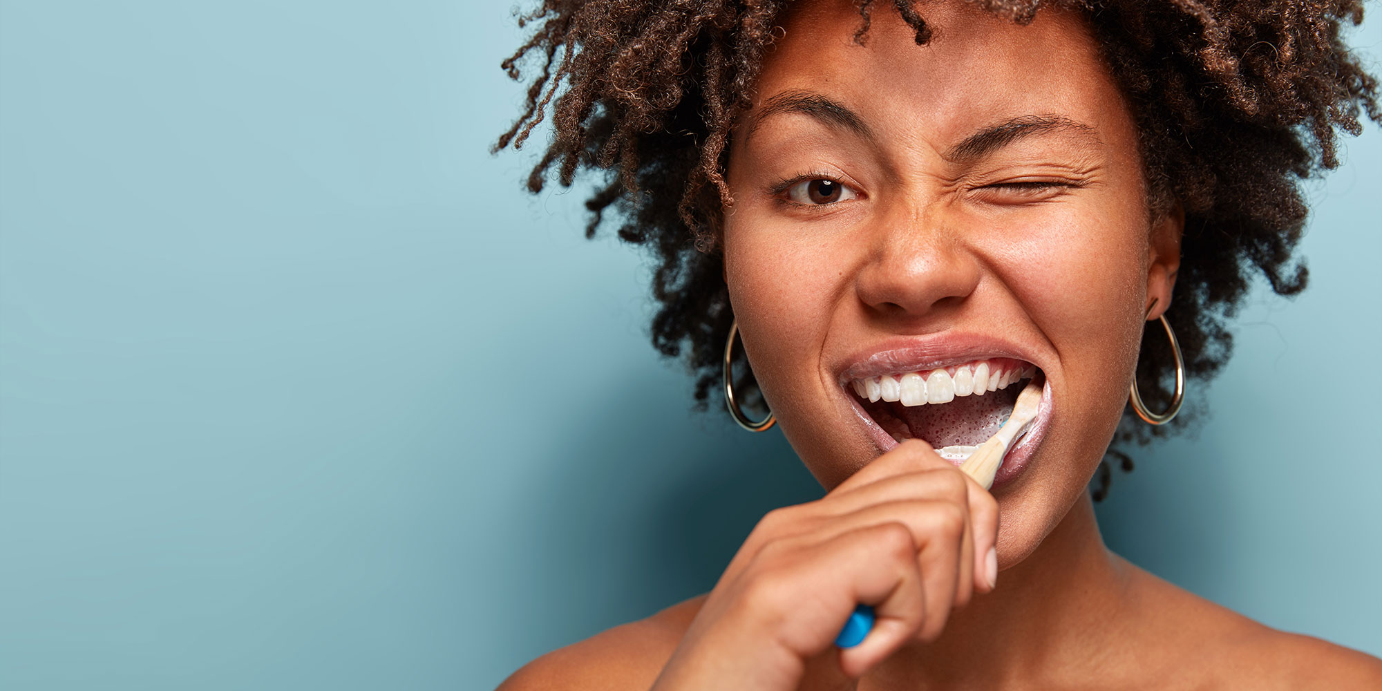 Patient brushing their teeth