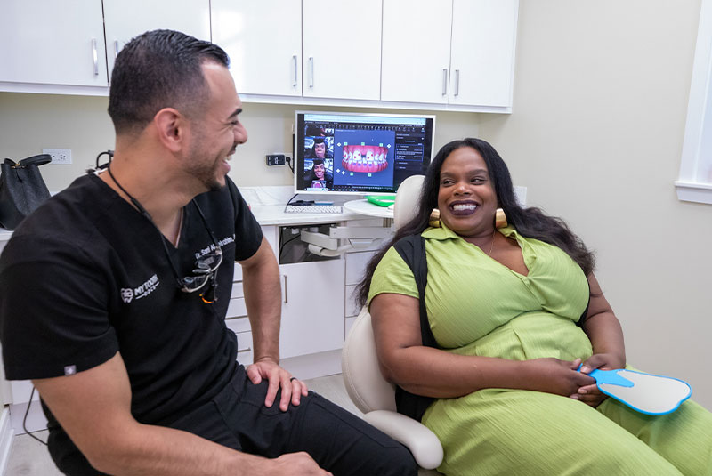 patient with dentist smiling